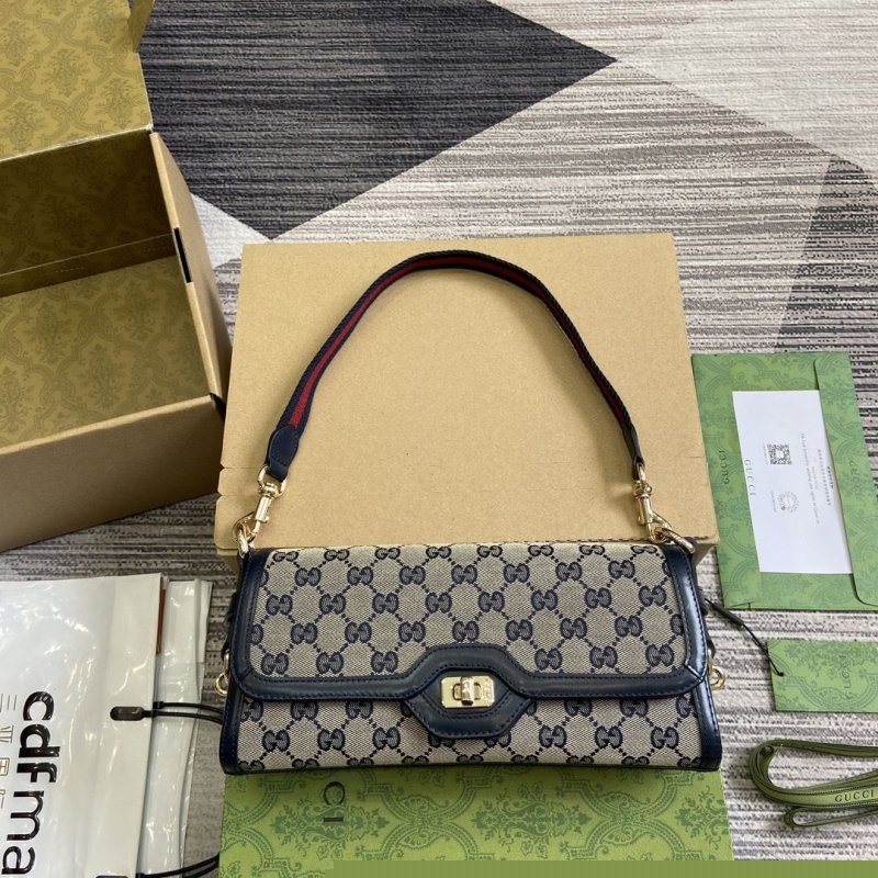 G*u*i top handle bags